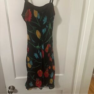 Hugo Buscati Black Dress with Colorful Floral Design like Nicole Martin’s RHOM
